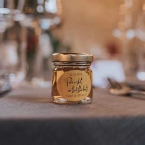 Cute Mini jar with gold lid filled with a shot for Wedding Favour