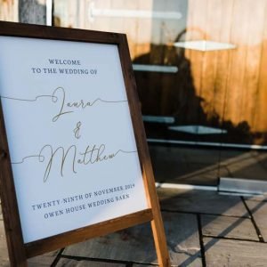 Wooden Welcome Sign at Wedding Entrance with Calligraphy text